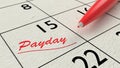 Red ballpen on a paper calendar closeup Royalty Free Stock Photo