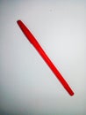 Red ballpoint pen on white background. One red pen for writing. Royalty Free Stock Photo