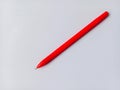 Red ballpoint pen on white background. One red pen for writing. Royalty Free Stock Photo