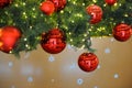 Red balls decorate the Christmas tree.