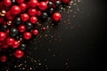 Red balls and gold sequins on a black background. Flat lay background with copy space for black Friday Royalty Free Stock Photo