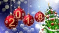 Red balls with numbers 2018 hanging on the background of a blue bokeh and a rotating Christmas tree Royalty Free Stock Photo