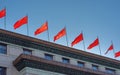 Red banners atop the National People`s Congress in Beijing, China