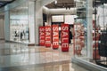 Red banners SALE on anti-thieft gate sensor at clothing store entrance. Black friday sale and seasonal discounts