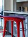 Red bar stool in a modern kitchen setting Royalty Free Stock Photo