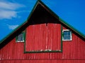 Red barn against the sky.