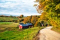 Traditional red wooden barn in a rural landscape in autumn Royalty Free Stock Photo