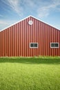 Red Barn with blue sky and gre