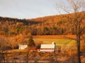 Red barn country house nestled in FingerLakes mountainside during Autumn Royalty Free Stock Photo
