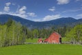 Red barn in the country on a spring day Royalty Free Stock Photo