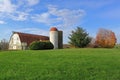 Red Barn and Dairy Silo on Green Meadow Royalty Free Stock Photo