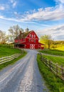 Red barn and dirt road in the countryside Royalty Free Stock Photo