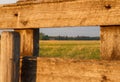 Red barn framed by wood boards