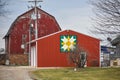 Red Barn with Green Gold and White Quilt Royalty Free Stock Photo