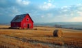 Red barn and hay bales in field Royalty Free Stock Photo