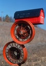 Red barn mailbox on tire rims