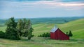 Red Barn morning over the rolling hills of the Palouse farm fields Royalty Free Stock Photo