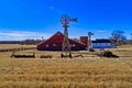 Red Barn in Parker, Colorado with a Historic Farm House behind it. Royalty Free Stock Photo