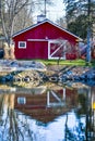 Red Barn Shed with Reflections in River