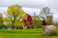 Red Barn with Round Hay Bale Royalty Free Stock Photo