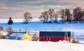 Red barn and snow-covered farm fields in rural York County, Penn Royalty Free Stock Photo