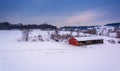 Red barn on a snow-covered farm in rural York County, Pennsylvania. Royalty Free Stock Photo