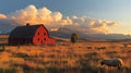 Red barn sunset, sheep grazing, mountain backdrop, idyllic rural scene Royalty Free Stock Photo