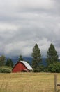 Red Barn Under Stormy Sky Royalty Free Stock Photo