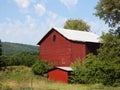 Vintage red wood barn in upstate NY FingerLakes countryside Royalty Free Stock Photo