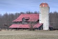 Red barn in the harvested fields. Royalty Free Stock Photo