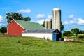 Red Barn and White Outbuilding with Two Silos