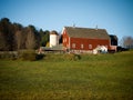 Red Barn with White Silo Sunset Royalty Free Stock Photo