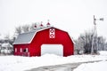 Red Barn with Windmill in the Snow Royalty Free Stock Photo