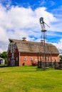 A red barn with a windmill on top Royalty Free Stock Photo