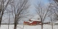Red barn on winter snow hilltop banner image Royalty Free Stock Photo