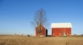 Red gable roof agriculture barns under blue sky FingerLakes NYS