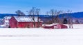 Red barns in a snow-covered field in rural York County, Pennsylvania. Royalty Free Stock Photo