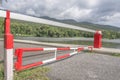Red Barrier Gate with mountain and lake background Royalty Free Stock Photo