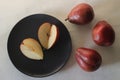 The Red Bartlett pear carries a true pyriform pear shape. A rounded bell on the bottom half of the fruit, then a definitive