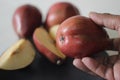 The Red Bartlett pear carries a true pyriform pear shape. A rounded bell on the bottom half of the fruit, then a definitive