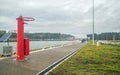 Red base of the navigation light on the Vistula Spit ditch Royalty Free Stock Photo