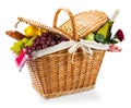 Wicker picnic basket with a red gingham cloth on a Royalty Free Stock Photo