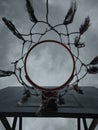 a red basketball hoop against a sky background with dark shades with the picture taken from the bottom position Royalty Free Stock Photo