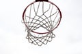 Red basketball hoop, basket against white sky. Outdoor basketball court. Royalty Free Stock Photo