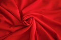 Red batiste made of cotton. sample of red soft fabric with pleats. Top view Royalty Free Stock Photo