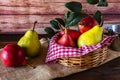 Red battler pears or red pear and packham or green pears in a basket on a table. Organic and natural products