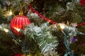 Red bauble christmas tree garland and lights Royalty Free Stock Photo