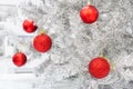 Red baubles on silver artificial christmas tree Royalty Free Stock Photo