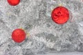 Red baubles on silver artificial christmas tree Royalty Free Stock Photo