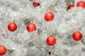 Red baubles on silver artificial christmas tree Royalty Free Stock Photo